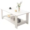 A white coffee table with a shelf underneath, decorated with a vase of flowers, a small decorative cube, a cup and saucer, a box, books, and a small speaker. Náhled obrázku produktu