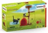 The image shows the packaging for a Schleich Farm World cat playset, featuring toy cats, a scratching post, and a cat house. Anteprima dell’immagine prodotto