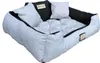 A light gray dog bed with black accents and two small white pillows. Náhled obrázku produktu