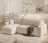 A modern living room and dining area with a sectional sofa, dining table, and kitchen island. Voir les images du produit