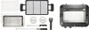 A collection of grill accessories and the grill unit are laid out on a white background. Produktbild-Vorschau