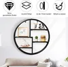 A round wall shelf with several items displayed on it, placed above a sofa. Anteprima dell’immagine prodotto