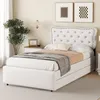 A bedroom scene featuring a white upholstered bed with a tufted headboard and storage drawers. Podgląd zdjęcia produktu