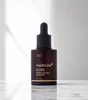 A brown glass bottle of Medicube Glutathione Glow Serum with a black dropper lid, placed on a reflective surface with a light gray background and shadows cast from the left. Produktbild-Vorschau