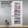 A hanging shoe organizer filled with shoes, mounted on a white door, with two plant stands to the left. Náhled obrázku produktu