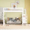 A white loft bed with a sofa underneath, decorated with pillows and blankets, in a room with yellow walls and a checkered rug. Produktbild-Vorschau