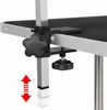 A close-up of a clamp mechanism on a grooming table leg, with an indicator showing adjustable height. Produktbild-Vorschau