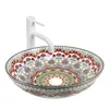 A decorative ceramic basin with a white faucet. Náhled obrázku produktu