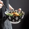 A person holding a bowl of food with a fork. Náhled obrázku produktu