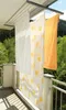 Laundry drying on a balcony with a scenic view of trees and mountains. Anteprima dell’immagine prodotto