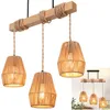 A three-light pendant lamp with a wooden beam and rope-wrapped shades, shown against a white background. A smaller inset image shows the lamp in a room setting. Produktbild-Vorschau