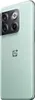 A close-up, angled view of the back of a green smartphone. Produktbild-Vorschau