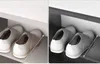 Two split images showing a pair of white leather oxford shoes on a shelf. Náhľad obrázku produktu