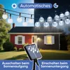 A split image showing a house with string lights on during the day and night, with a solar panel in the foreground. Produktbild-Vorschau