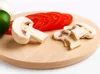 A wooden cutting board with sliced tomatoes, mushrooms, and a green pepper. Podgląd zdjęcia produktu