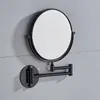 A black, wall-mounted, extendable makeup mirror is shown against a gray tiled wall. Produktbild-Vorschau