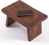 A small wooden stool with a smartphone placed on top, against a white background. Náhľad obrázku produktu