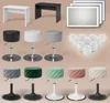 A collection of vanity tables and stools, along with vanity lights and bulbs, arranged on a light brown background. Produktbild-Vorschau