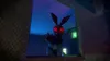 A creepy animatronic rabbit with glowing red eyes is peeking out from a dark opening. Náhled obrázku produktu