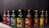 A row of spice containers from 'The Spice Lab' are displayed against a dark background. Produktbild-Vorschau