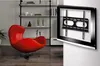 A modern living room with a red egg chair and a TV wall mount shown on a textured wall. Anteprima dell’immagine prodotto