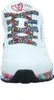 A close-up front view of a white Skechers sneaker with colorful, abstract patterned laces and sole. Voir les images du produit