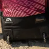 A close-up view of the bottom section of a rolling duffel bag, showing its wheels and branding. Produktbild-Vorschau