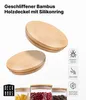 Zwei Bambusdeckel mit weißen Silikonringen, gezeigt über drei mit Nudeln, Bohnen und Kaffee gefüllten Glasgläsern Produktbild-Vorschau
