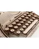 A close-up view of a wooden typewriter model, focusing on the keys and part of the paper feed mechanism. Podgląd zdjęcia produktu