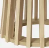 A close-up view of the wooden base and legs of a table. Produktbild-Vorschau
