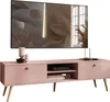 A pink TV stand with wooden legs, a television, and decorative items. Produktbild-Vorschau