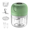 A product shot of a mini food chopper and its accessories, laid out against a white background. Produktbild-Vorschau