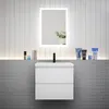 A modern bathroom vanity with a white ceramic sink and a white matte cabinet with two drawers, set against a tiled wall. Produktbild-Vorschau