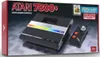 The image shows the retail packaging of an Atari 7800+ video game console, including the console itself and a controller. Produktbild-Vorschau