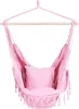 A pink hammock chair with a pillow, suspended from a wooden bar. Náhled obrázku produktu