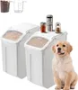 A golden retriever puppy sits next to two white pet food storage containers. Náhled obrázku produktu