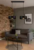 A modern living room with a grey sofa, coffee table, and brick wall. Náhled obrázku produktu