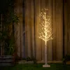 A decorative LED tree with neutral white lights stands in a garden setting at night, with a wooden fence and plants in the background. Produktbild-Vorschau