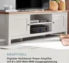 A white media console with a TV and audio equipment on it, placed on a rug. Produktbild-Vorschau