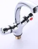 A close-up studio shot of a chrome faucet with temperature controls. Produktbild-Vorschau
