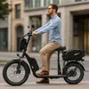 A man riding an electric scooter on a city street. Produktbild-Vorschau