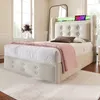 A bedroom scene featuring a bed with a headboard that has built-in LED lighting and a shelf. Produktbild-Vorschau
