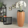 A living room or office setting with decorative items. Voir les images du produit