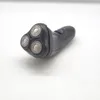 A black electric shaver with three rotary heads is shown on a white background. Voir les images du produit