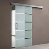 A frosted glass sliding door with horizontal opaque stripes and a metal handle, mounted on a track above a wall. Produktbild-Vorschau