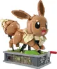 A LEGO-style Eevee Pokemon figure on a display base with visible gears. Náhľad obrázku produktu