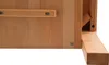 A close-up view of the corner of a wooden furniture piece, showing joinery and hardware. Voir les images du produit