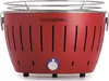 A red LotusGrill S Small G280 charcoal table grill is shown from the front on a white background.