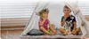 Two children are playing inside a teepee tent. Produktbild-Vorschau