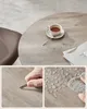 A round table with a cup of tea and a magazine, shown with close-ups of durability tests. Náhled obrázku produktu